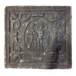 Cast iron fireback from the Renaissance period adorned with a medallion