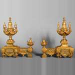 Beautiful pair of Louis XVI style gilt bronze firedogs with vases