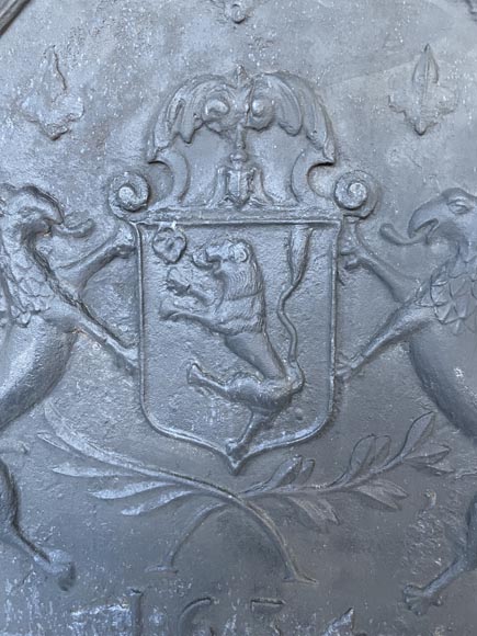Cast iron fireback with armorials dated 1634, -1