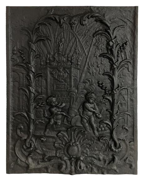 Cast iron fireback with putti firing a cannon-0