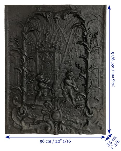 Cast iron fireback with putti firing a cannon-9