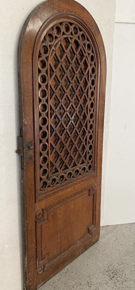 Oak entrance door with open decoration and curved top-1