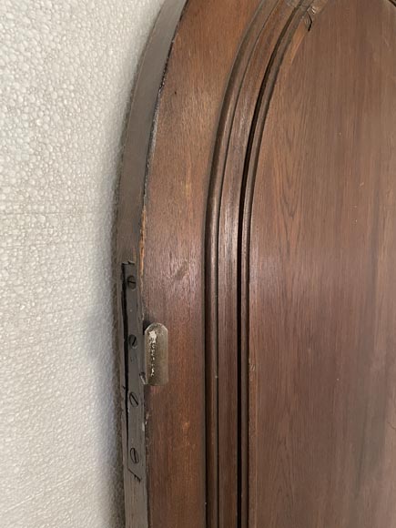 Oak entrance door with open decoration and curved top-10