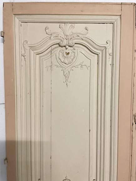 Beautiful sculpted wood double door with a monogram-1