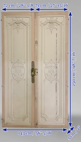 Beautiful sculpted wood double door with a monogram-16