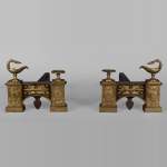 Pair of gilt bronze Empire style firedogs with oil lamps