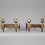 Bouhon: Pair of Louis XVI style firedogs in gilt bronze with stylized pine cones