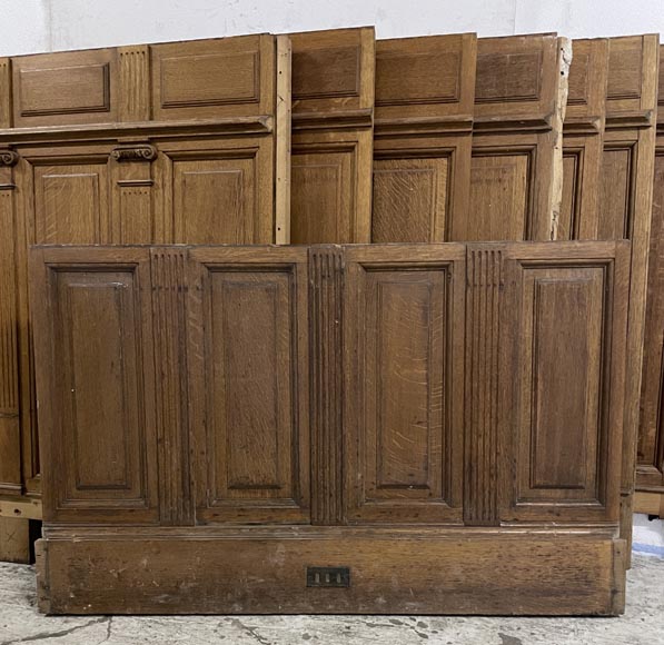 Series of about 10 linear meters of paneled room's bases in oak with Ionic capitals-1