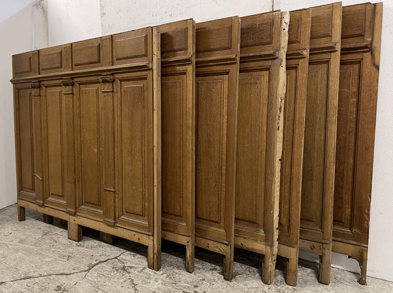 Series of about 10 linear meters of paneled room's bases in oak with Ionic capitals-3