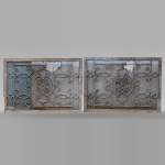 Pair of wrought iron front radiators with intertwined L