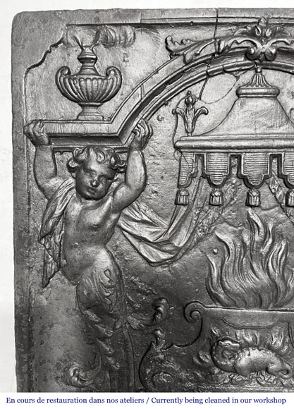 18th-century fireplace plaque with a salamander and two atlantes supporting an entablature with fire vases-1