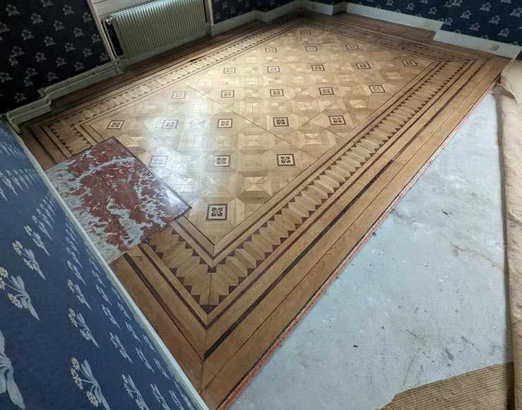 Parquet flooring with wood marquetery depicting diamond shapes and
