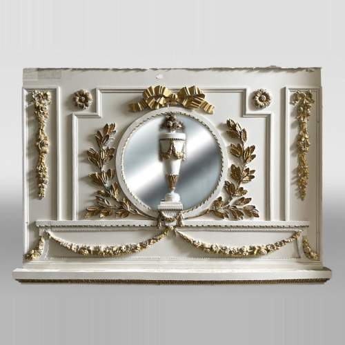 Carved, regilded and white-painted wooden paneling