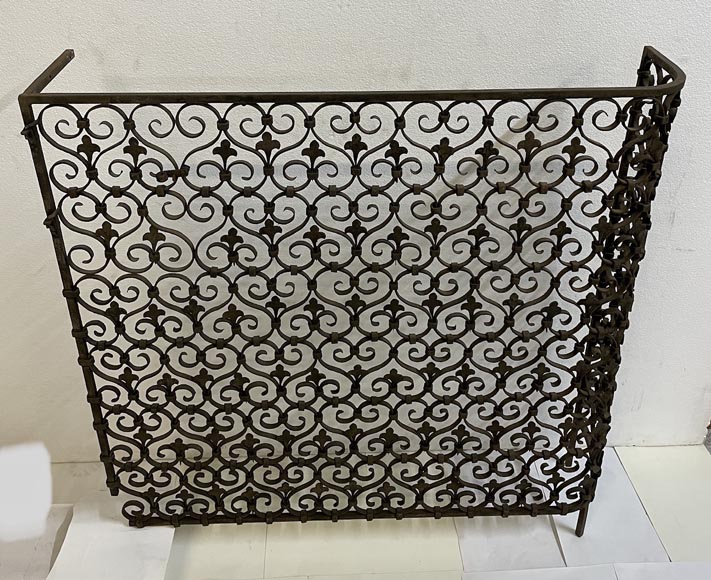 Wrought iron radiator railing decorated with volutes and fleur-de-lis-2