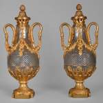 Pair of Louis XVI style crystal and gilt bronze vases