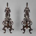 Pair of silvered iron and cat iron andirons with standing lions