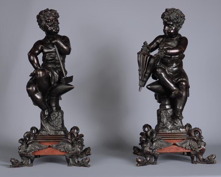 Pair of antique bronze and red andirons representing small blacksmiths-1