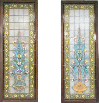 Pair of enamelled glass stained glass windows decorated with a vase of flowers