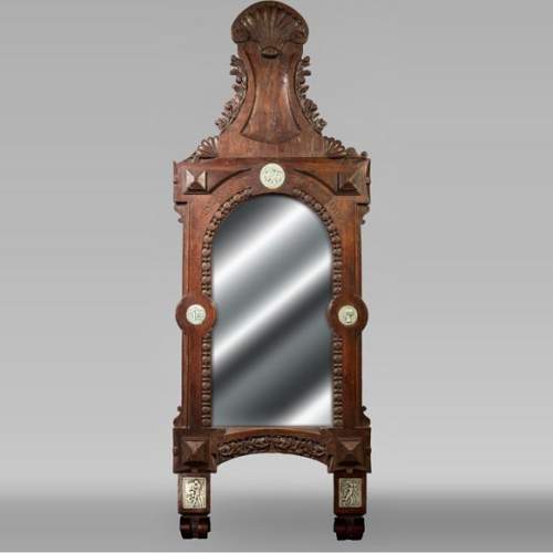 DECK Théodore, monumental oak mirror with green glazed faience medallions