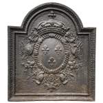 18th century fireback decorated with three lilies, emblems of the arms of France