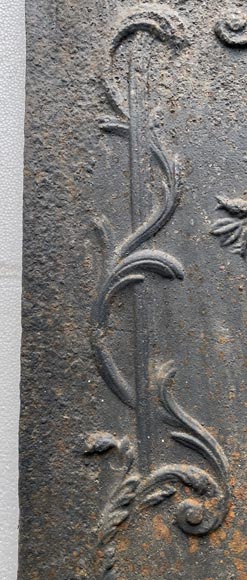 18th century fireback representing a female figure with a flower garland next to an antique vase-6