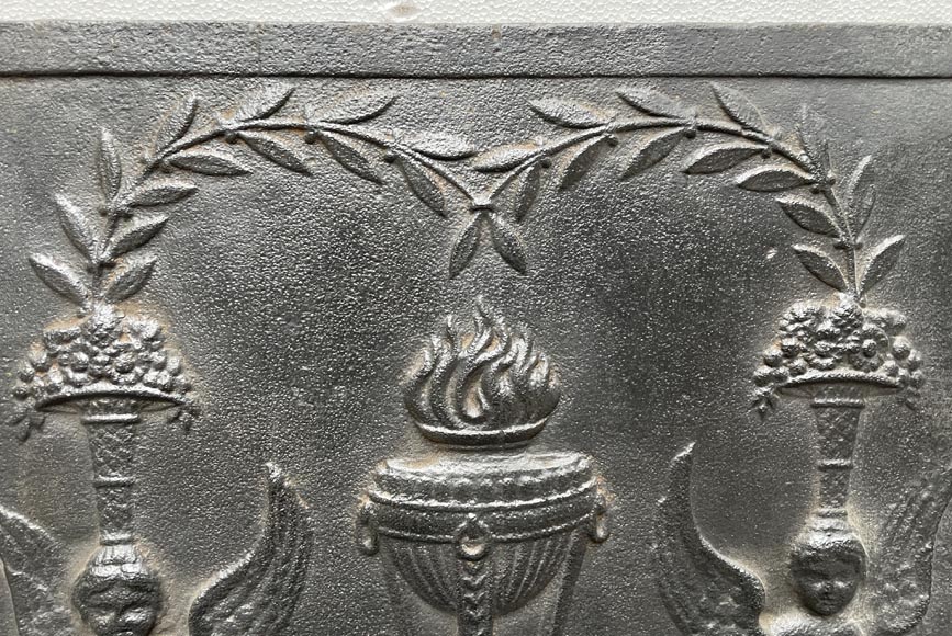 Fireback from the end of the 18th century with a vase of flames framed by sphinges-1