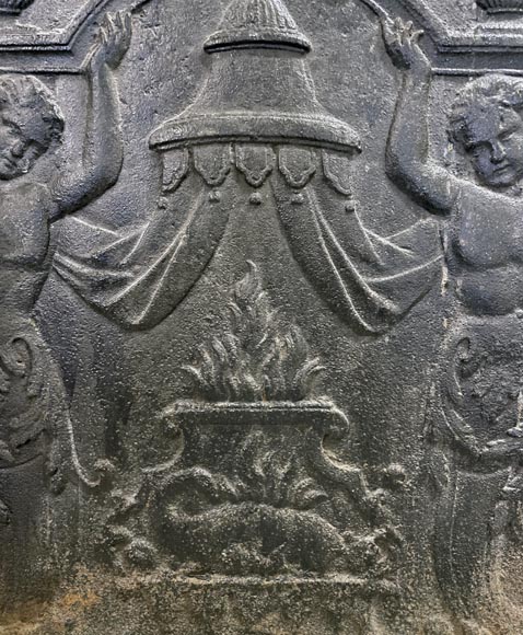 Fireback of the 18th century with two atlantes supporting an entablature with fire vases-2