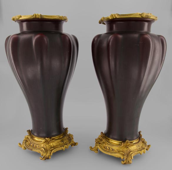 Eugène BAUDIN (att. to), Pair of sandstone vases set in a gilded bronze frame-0