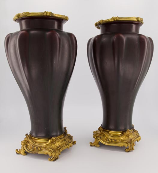 Eugène BAUDIN (att. to), Pair of sandstone vases set in a gilded bronze frame-1