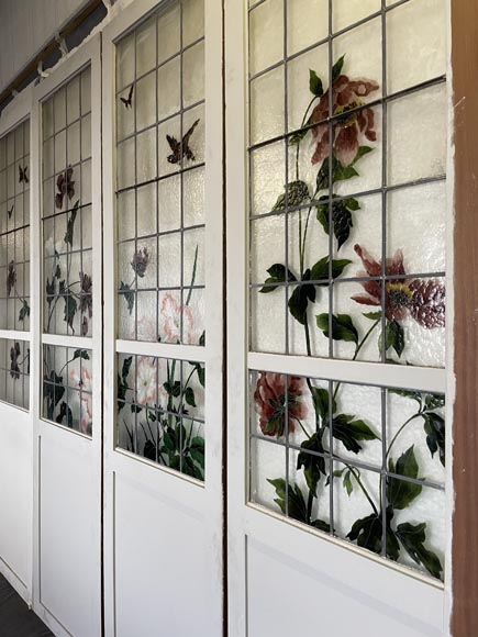 Quadruple sliding door with stained glass windows featuring birds and plants-5