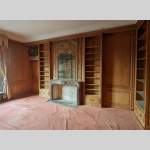 Moulded oak bookcase with wood paneling