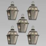 Lot of simple lanterns and their iron gallows