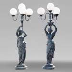 Pair of cast iron floor lamps in the shape of draped women