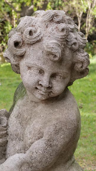 Sculpture of a putto with a flowering basket in composite stone-2