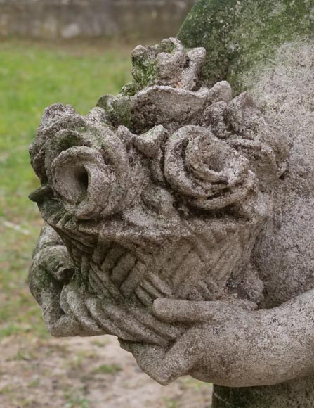 Sculpture of a putto with a flowering basket in composite stone-3