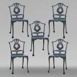 Five chairs of garden furniture in cast iron