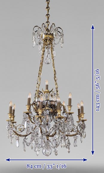 Louis XVI style chandelier in gilt bronze and crystals decorated