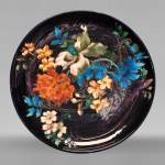 Théodore DECK, circular dish decorated with flowers on an eggplant background, after 1870