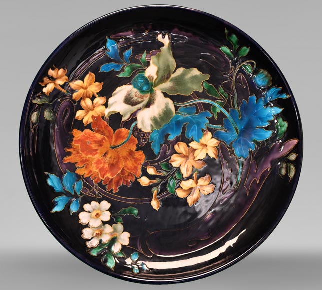 Théodore DECK, circular dish decorated with flowers on an eggplant background, after 1870-0