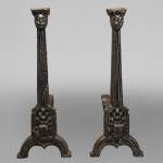 Pair of andirons with faces
