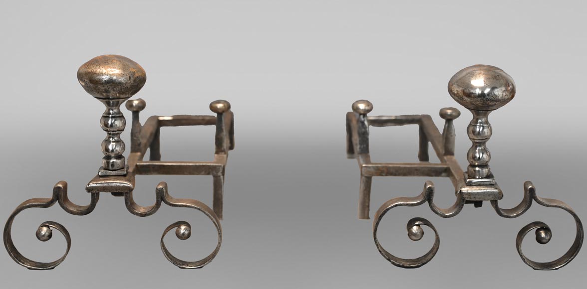 Pair of scrolled andirons topped with a ball-0
