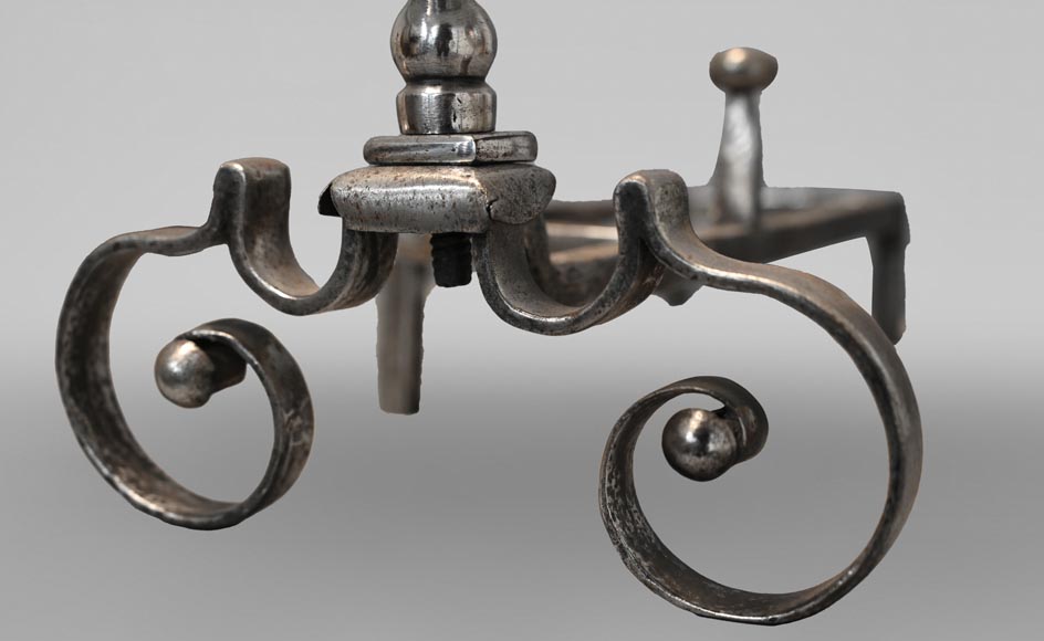 Pair of scrolled andirons topped with a ball-4