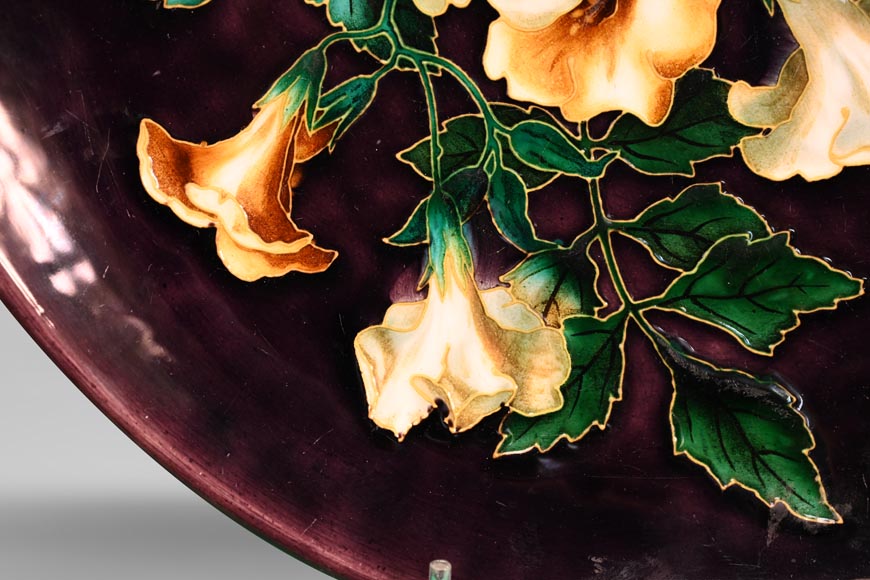 Théodore DECK, circular dish decorated with flowers and butterfly on an eggplant background, after 1870-2