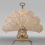 Large Napoleon III style fan-shaped fire screen with dolphin and putti decoration