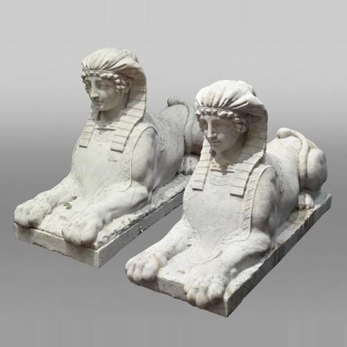 Pair of carved Carrara marble sphinxes