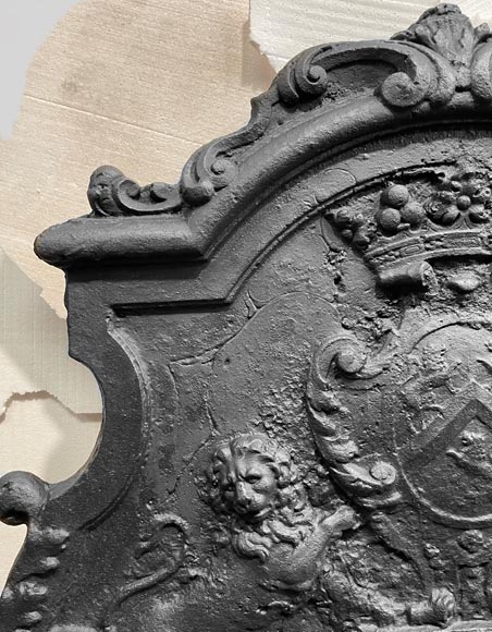 Fireback bearing a coat of arms and decorated with lions-1
