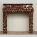 Antique Louis XIV style marble mantel with acroterion