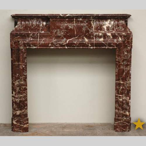 Antique Louis XIV style marble mantel with acroterion