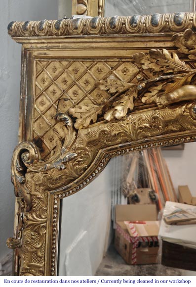 A richly gilded trumeau in the Napoleon III style, decorated with putti A richly gilded trumeau in the Napoleon III style, decorated with putti-4