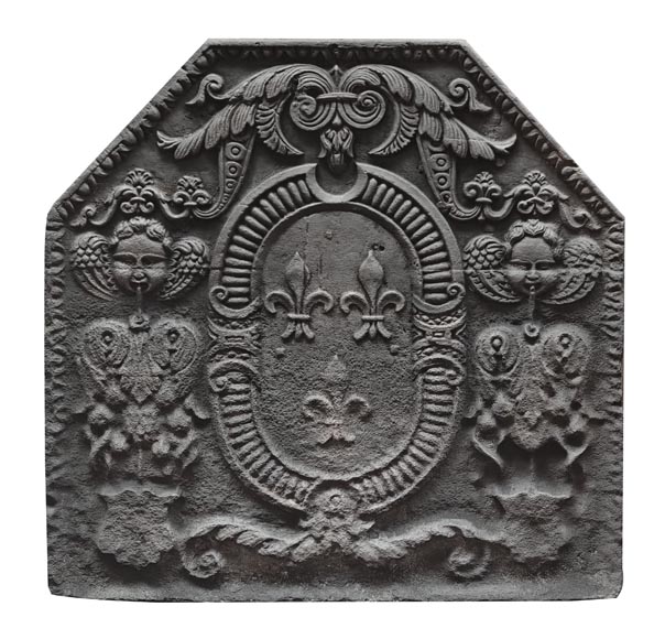 Cast iron fireplace plaque bearing the Arms of France, framed by cherubs-0